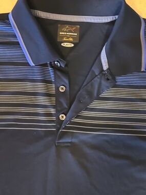 Greg Norman Collection Navy Blue Polo with Light Blue and Gray Stripes Play Dry